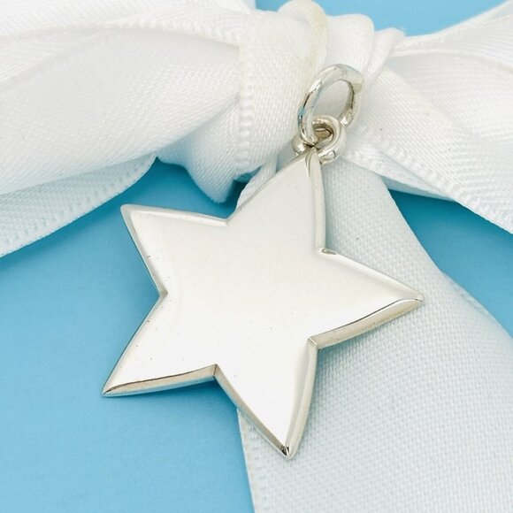 Tiffany & Co Star Charm or Pendant in Sterling Silver - Picture 1 of 7
